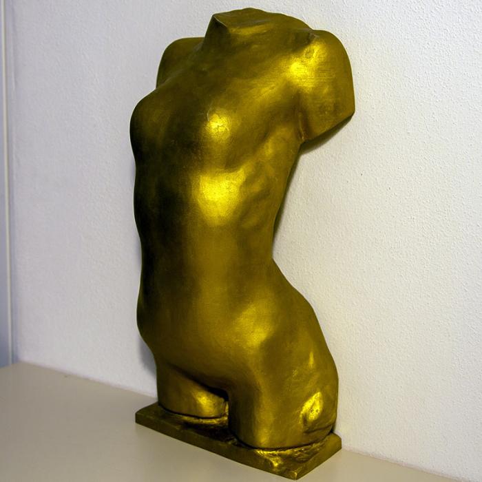 Golden torso of young woman